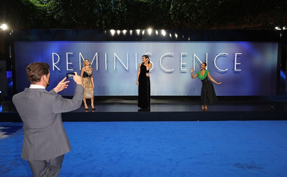 "Reminiscence" premiere in London, Hugh Jackman kneeling in a suit