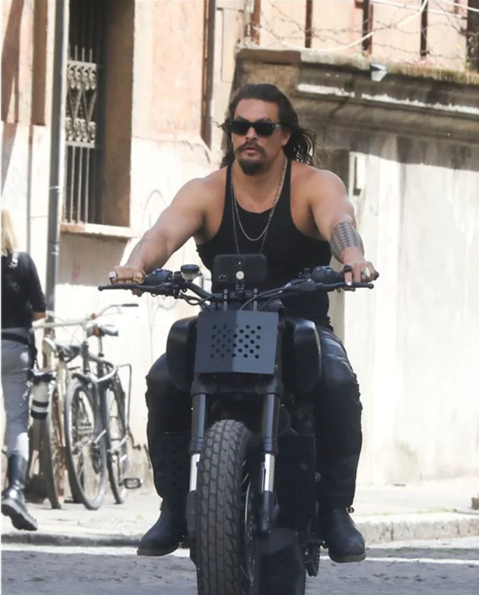 "Aquaman" Jason Momoa on the set of "Fast & Furious 10" in Rome, riding a motorcycle on the street