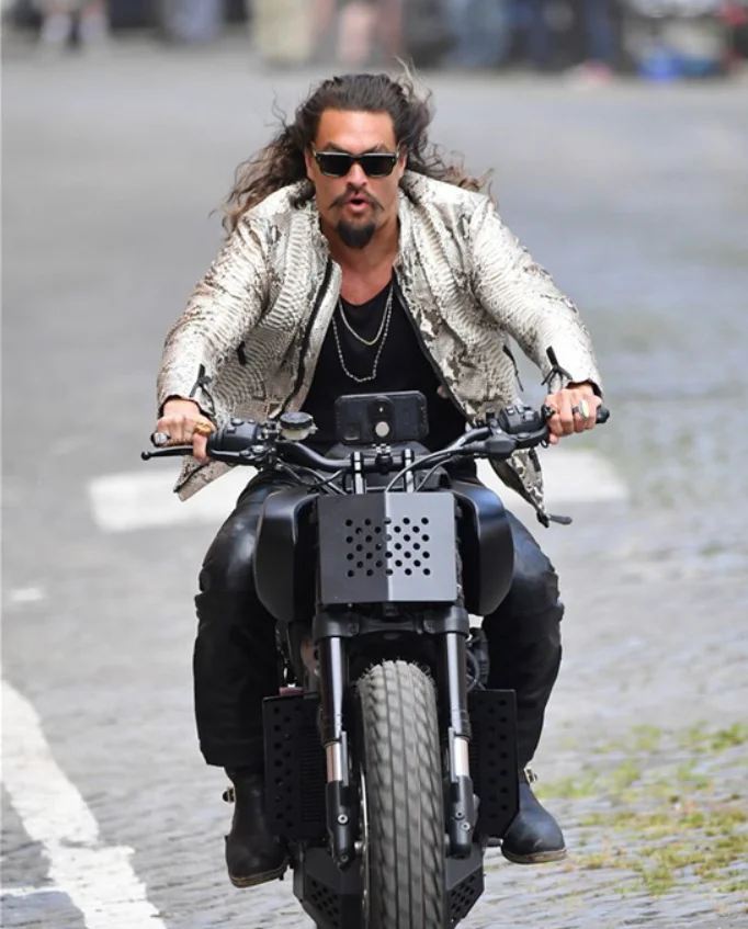 "Aquaman" Jason Momoa on the set of "Fast & Furious 10" in Rome, riding a motorcycle on the street