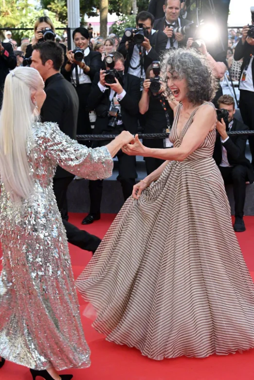Helen Mirren and Andie MacDowell dance on the red carpet of the 'Mother and Son' Cannes premiere