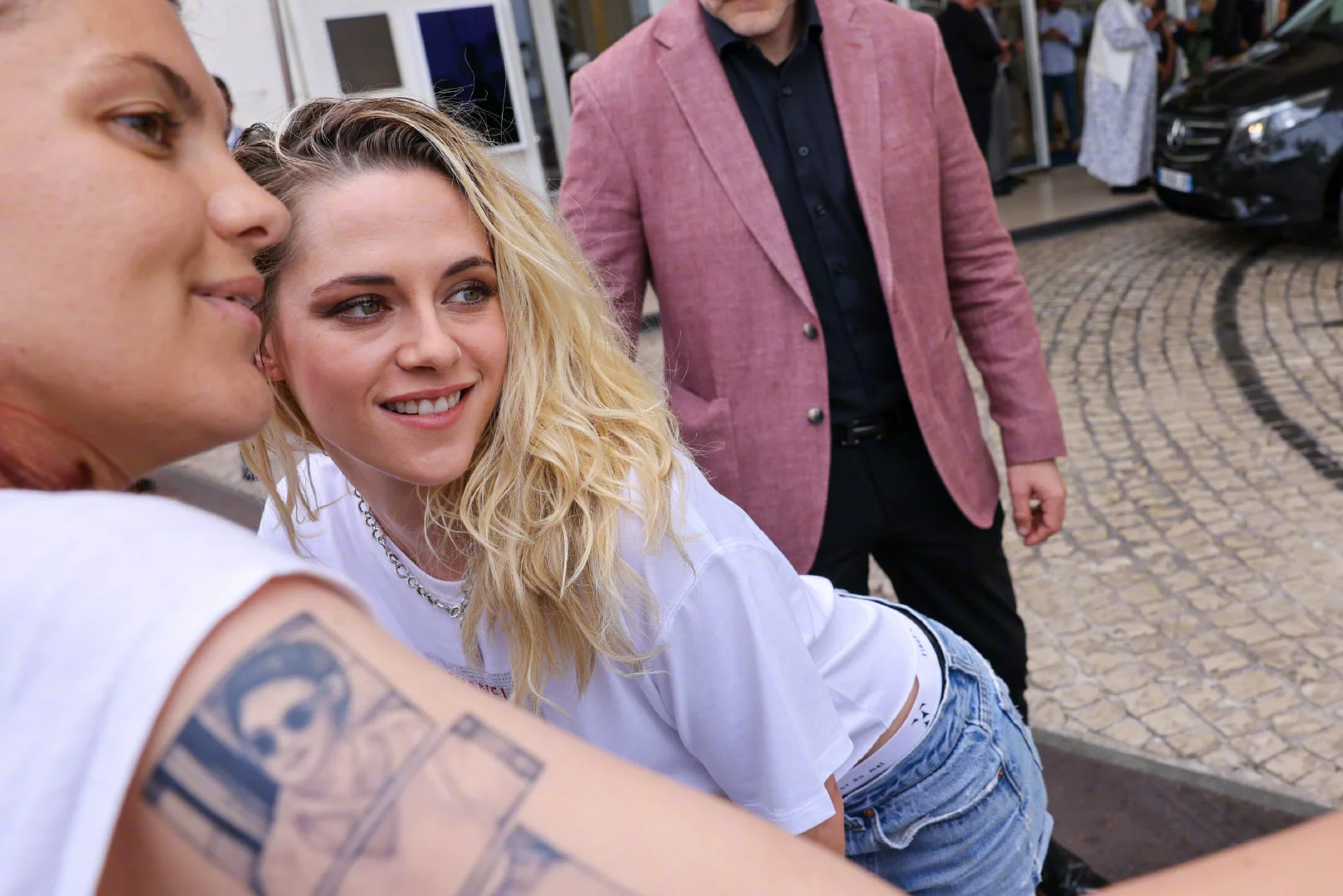 Kristen Stewart appears in Cannes, posing with fans on the way