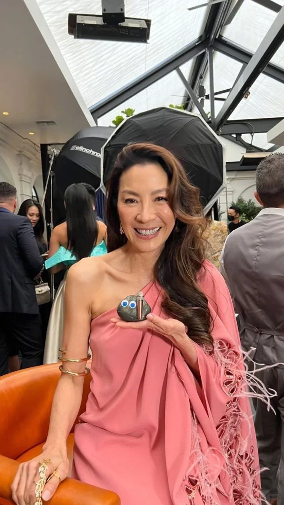 Michelle Yeoh poses with the "Everything Everywhere All at Once" stone