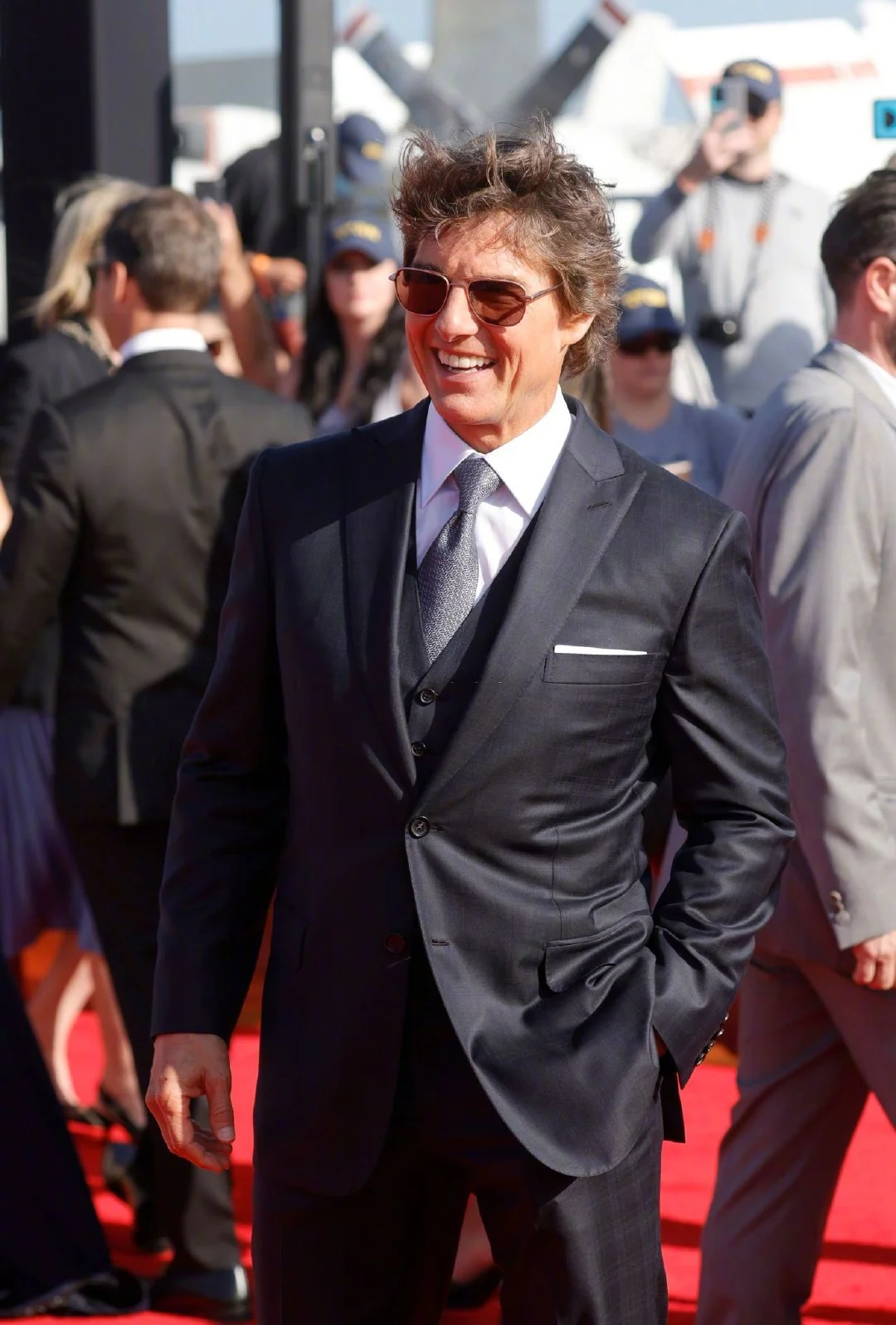 Tom Cruise lands in a helicopter at the world premiere of "Top Gun: Maverick"