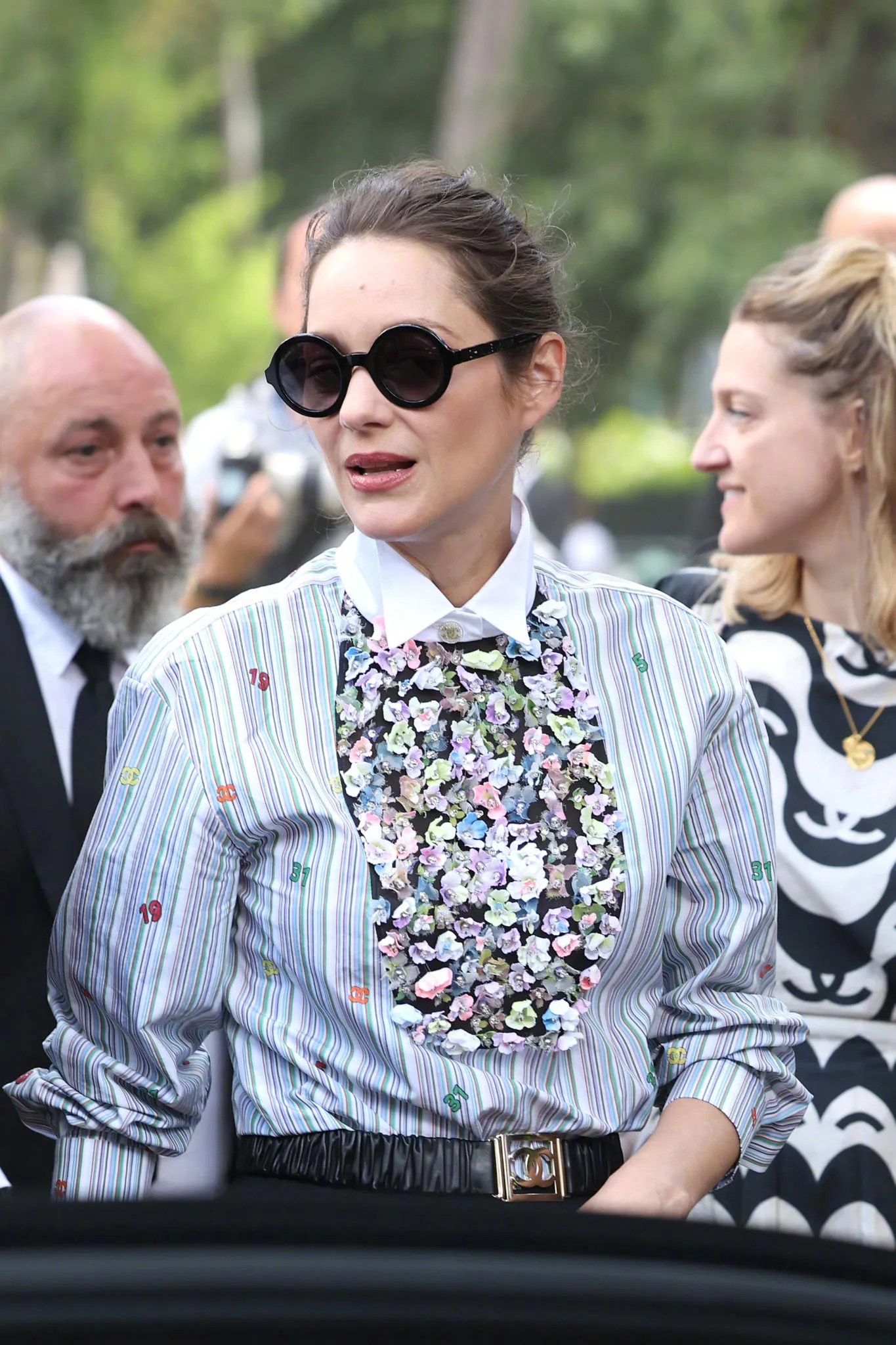 Marion Cotillard watches the catwalk at Paris Fashion Week | FMV6