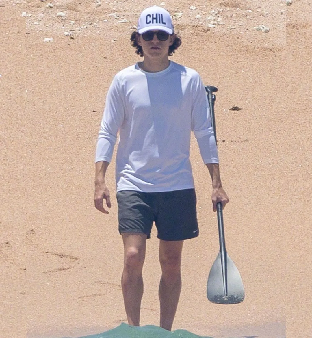 Tom Holland paddle board at the beach | FMV6
