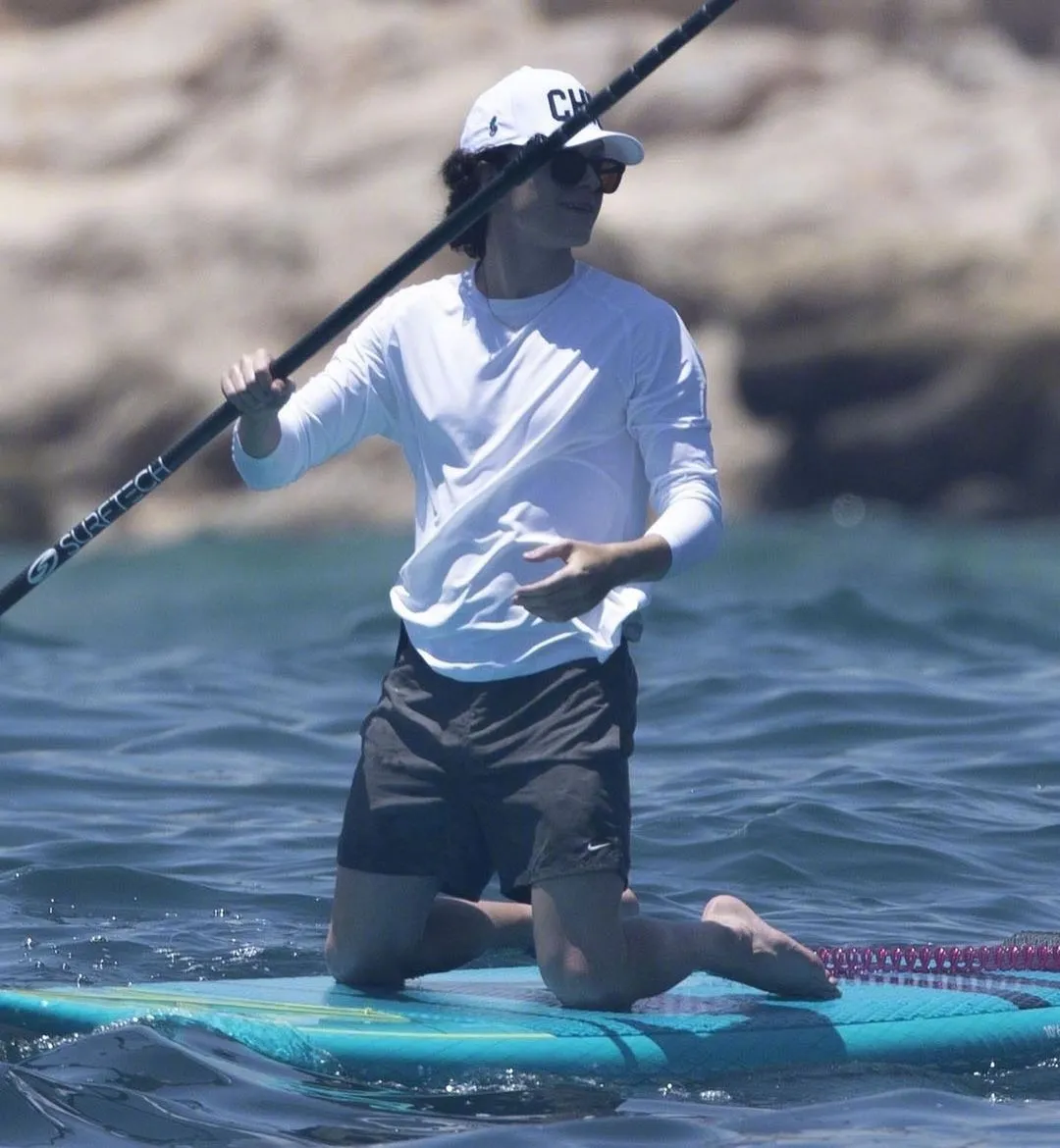 Tom Holland paddle board at the beach | FMV6
