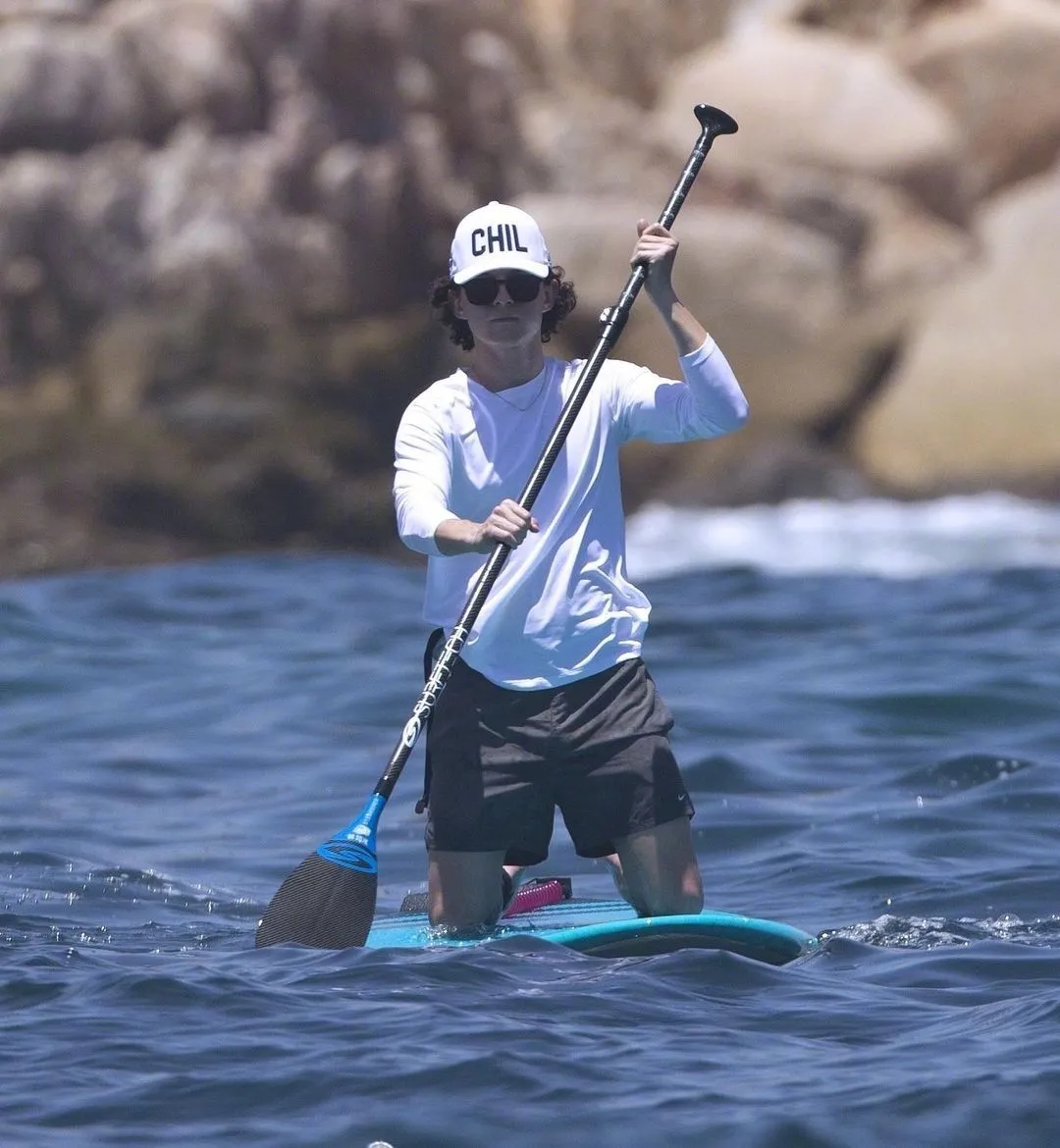 Tom Holland paddle board at the beach | FMV6