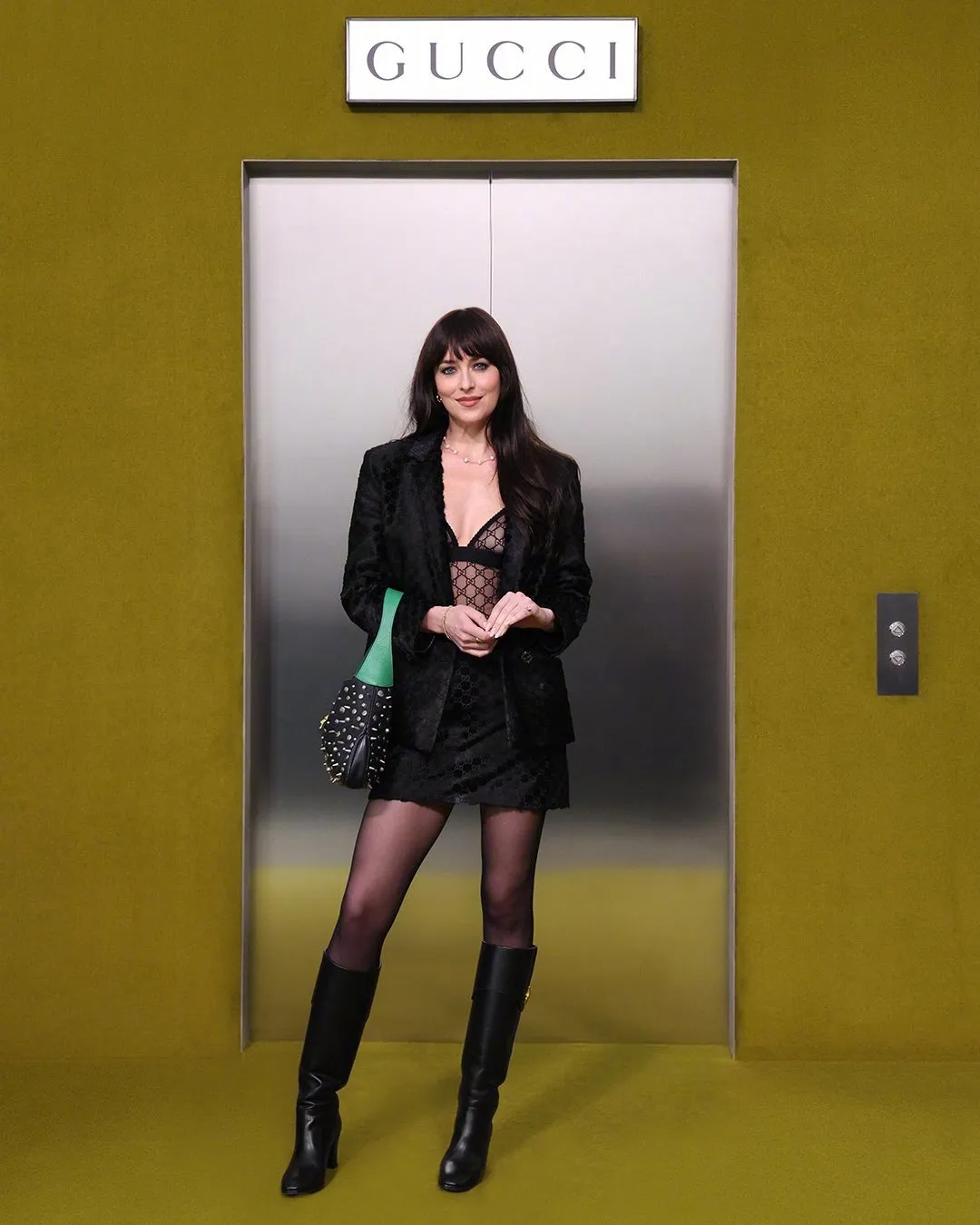 Dakota Johnson watches the catwalk at Milan Fashion Week | FMV6
