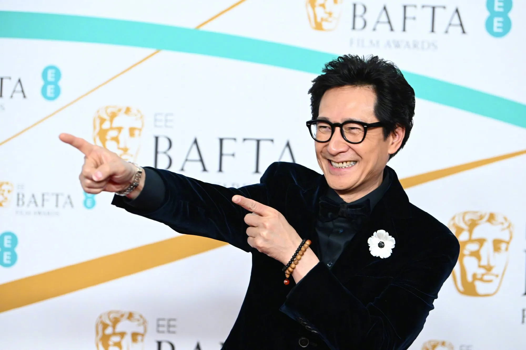 Jonathan Ke Quan attends 2023 British Academy Film Awards red carpet | FMV6