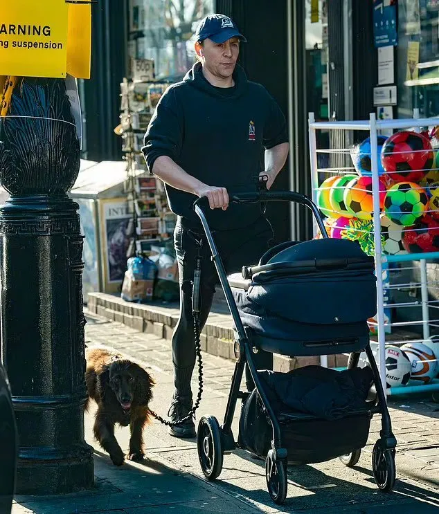 Photos of Tom Hiddleston taking his baby out | FMV6